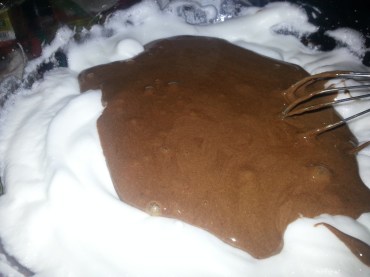 Fold egg yolk mixture into stiff egg whites